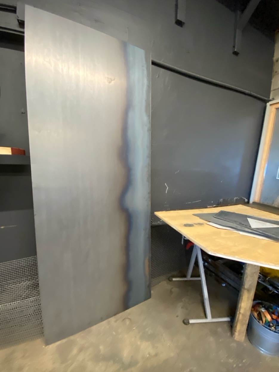 Hot rolled steel panel for custom fireplace surround in Reno-Tahoe home