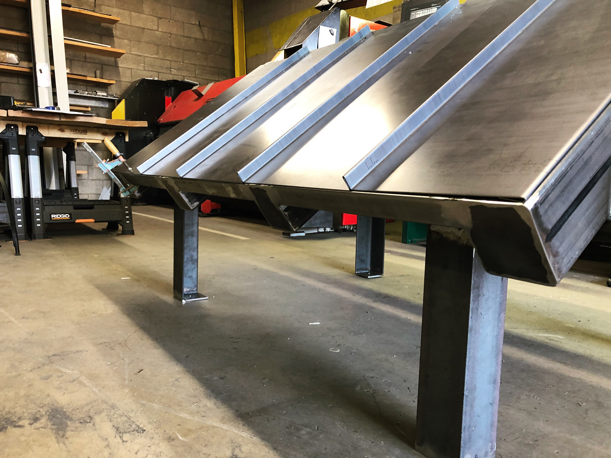 Range hood being fabricated in the shop